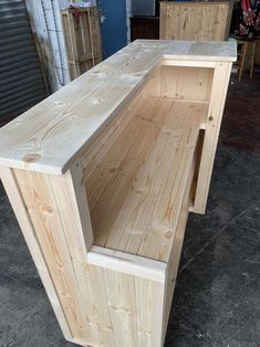 two unfinished wooden benches sitting next to each other