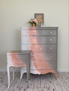 two silver dressers with pink paint on them