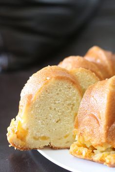 a bundt cake on a plate with one slice cut out