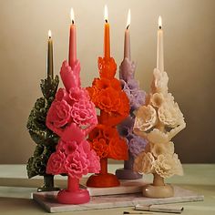 a group of candles sitting on top of a table