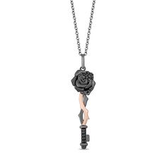 From the Enchanted Disney Fine Jewelry Villains Collection inspired by Maleficent, this diamond key pendant reveals your dramatic flair. Fashioned in sterling silver with black rhodium plate and 10K rose gold, this elegant design features a sandblast-textured rose top lightly adorned with alluring enhanced black diamonds. Rose gold and black rhodium vines twist along the while additional enhanced black diamonds glisten beside the bit. Radiant with 1/8 ct. t.w. of diamonds and a brilliant buffed Black Diamond Pendant, Enchanted Disney, Enchanted Disney Fine Jewelry, Cvd Diamond, Rose Pendant, Disney Jewelry, Key Pendant, Sterling Silver Necklace Pendants, Maleficent