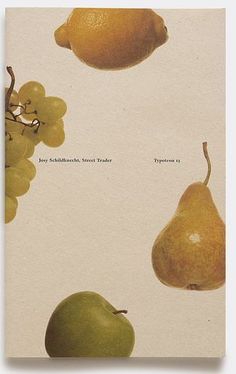 two pears, one green apple and the other yellow with white writing on it