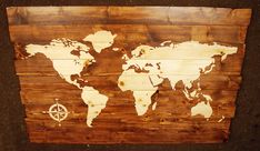 a wooden sign with a world map on it