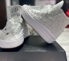 Custom made Platform Converse's for the bride. Each sneaker is made with pearls and rhinestones for the ultimate bridal gift! In the personalized section, please indicate, the date of your wedding and your married last name. White Custom Sneakers With Rhinestones For Wedding, Custom Wedding Sneakers With Rhinestones, Wedding Custom Sneakers With Rhinestones And Round Toe, Elegant Wedding Sneakers With Rhinestones, Silver Sneakers For Wedding With Round Toe, Silver Lace-up Sneakers For Wedding, Bride's Low-top Wedding Shoes With Rhinestones, Low-top Bride Wedding Shoes With Rhinestones, Low-top Wedding Shoes With Rhinestones For Bride