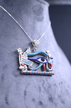 an egyptian necklace with an eye on it