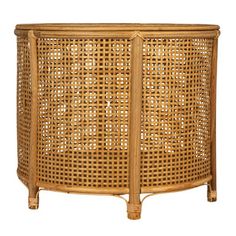 a round wicker basket with handles on the top and bottom, sitting against a white background