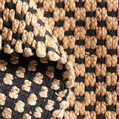 a close up view of a black and white rug