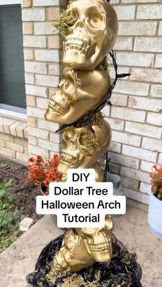 three gold skulls stacked on top of each other with the words diy dollar tree halloween arch