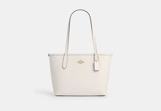 This Small City Tote is crafted of double face leather that elevates your every day. Perfect for any day of the week this smaller leather tote bag carries your essentials on the go. A versatile favorite it features an easy snap closure and an interior zip pocket to help keep your items secure. Coach Small Tote Bag, Coach Small City Tote, Coach Mini City Tote, White Tote Satchel With Gold-tone Hardware, Tote Bag Coach, Tote Coach, White Tote Shoulder Bag With Silver-tone Hardware, Sling Bag Mini, City Tote Bag