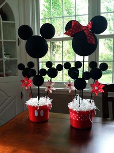 mickey mouse centerpieces in red buckets with bows