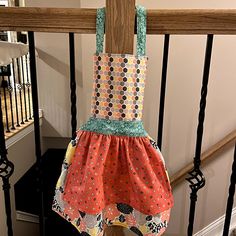 an apron hanging on the banister rail