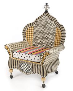 an upholstered chair with black and white checkered fabric on the back, sitting in front of a white background