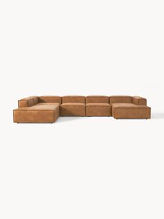 a brown leather sectional couch on a white background