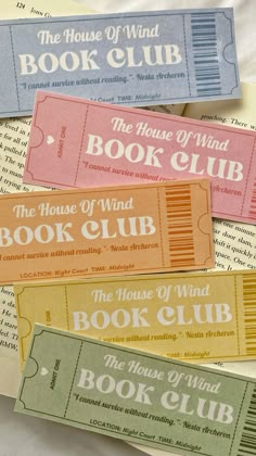 four tickets for the house of wind book club are laying on top of each other