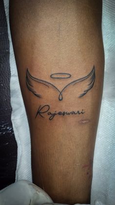 a woman's leg with a tattoo on it that reads, regnani