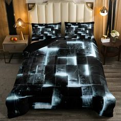 a bed with black and white designs on it