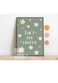 an art print with the words isn't she lovely in white and yellow flowers