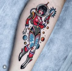 a woman in an astronaut suit on her leg with stars and planets around her arm