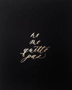 the words are written in gold foil on a black background