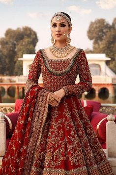 a woman in a red bridal gown