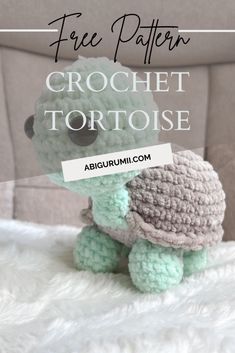 a crochet tortoise sitting on top of a bed with the text free pattern