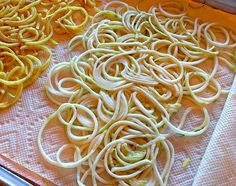 there are many different types of noodles on the trays and ready to be cooked