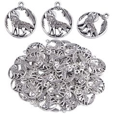 silver plated charms and pendants with an image of a wolf in the center