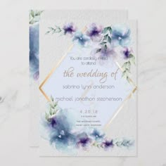 a wedding card with watercolor flowers on the front and back, in blue tones