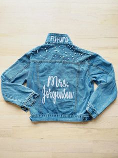 a jean jacket with writing on the back