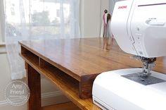 a sewing machine sitting on top of a wooden table