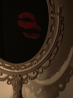 a mirror with a reflection of a woman's lips on it