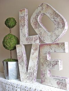 the word love is made out of wood letters