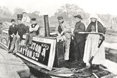 an old black and white photo of people on a boat