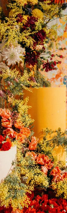 an image of flowers arranged in the shape of a flower arrangement on a table top