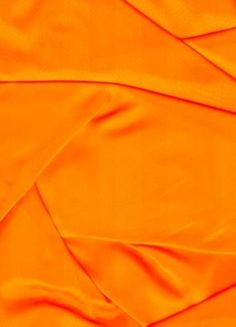 an orange fabric with very thin folds