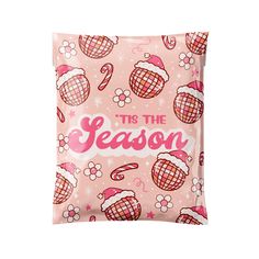 a pink pillow that says tis the season on it