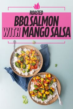 two plates filled with rice, broccoli and mango salsa on top of a blue table