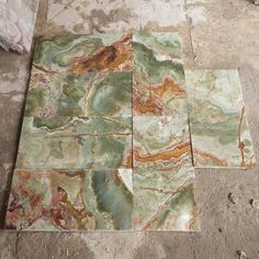 marble tiles laid out on the ground with different colors and shapes to choose between them