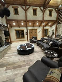 a large living room with two couches and a fireplace