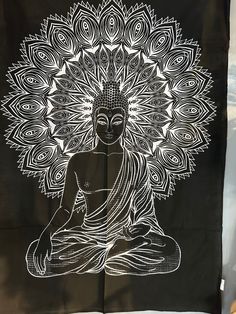 a black and white drawing of a buddha sitting in the middle of a lotus pose