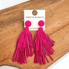 Circle beaded stud earrings with a beaded tassel in hot pink. These earrings are pictured laying on a brown piece of wood on a white background. Giddy Up Glamour, New And Improved, Beaded Dangle Earrings, Tassel Earrings, Bead Crafts, In Hot, Tassel Necklace, Tassels, Hot Pink