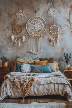 a bed sitting in a bedroom next to a wall with dream catchers on it