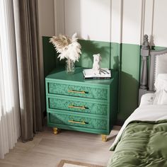 a green chest of drawers sitting next to a bed