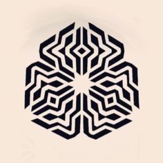 an abstract black and white design on a white background in the shape of a snowflake