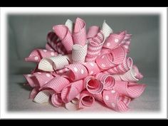 a bouquet of pink and white bows