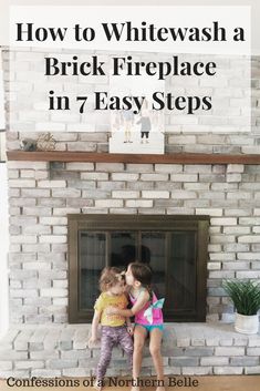 two children kissing each other in front of a brick fireplace with the words how to whitewash a brick fireplace in 7 easy steps