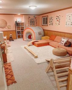 a living room filled with lots of furniture next to a fire place in the corner