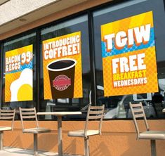 there are three chairs in front of the window with signs on them that say it's free breakfast wednesday