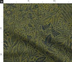 an image of a green and blue fabric with leaves on it's side, as well as numbers