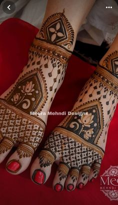 the feet are decorated with henna designs